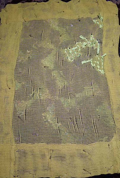 The beginnings of attaching the backing to the rug.